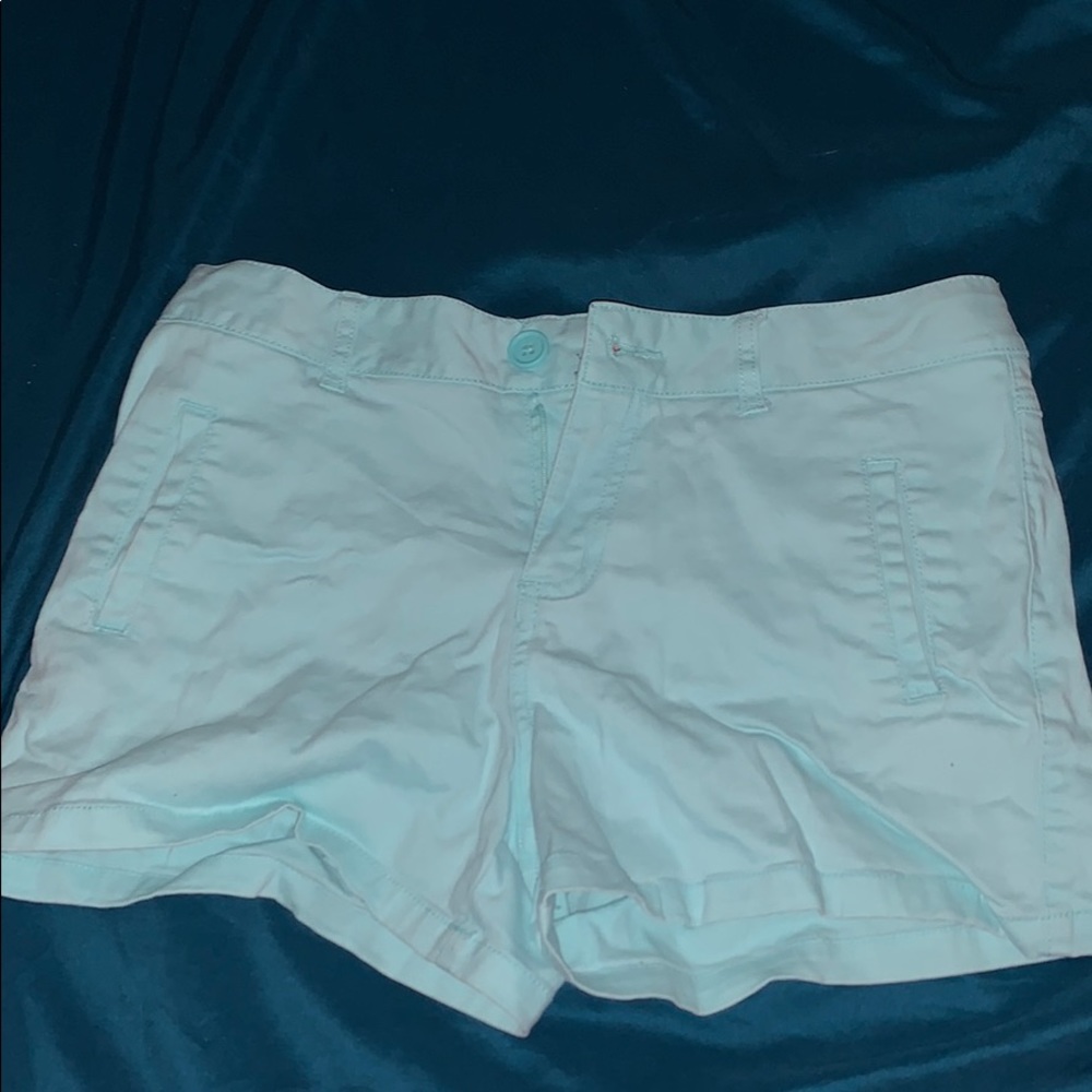 a pair of blue shorts for a youth.